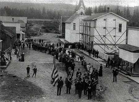 July 4th Parade at Butteville, 1904. Note Butte Road running past The Butteville Store, Odd Fellows Hall and Masonic Hall down to the river [Photo courtesy OPRD]